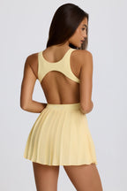 [LIMITLESS_COLOR:LEMON] BO+TEE Soft Active Open-Back Pleated Tennis Dress — LEMON — Vista oficial 2