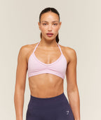 [LIMITLESS_COLOR:HAZE PINK] GYMSHARK Light Support Minimal Halterneck Bra — HAZE PINK — vista oficial 1