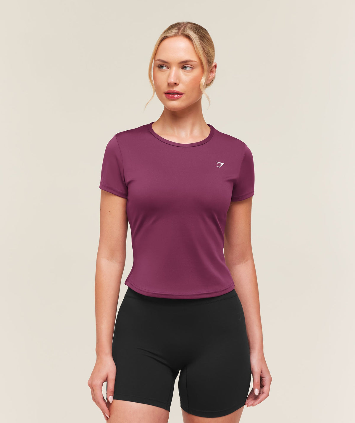 [LIMITLESS_COLOR:STRENGTH PINK] GYMSHARK Training Baby Tee — STRENGTH PINK — vista oficial 1