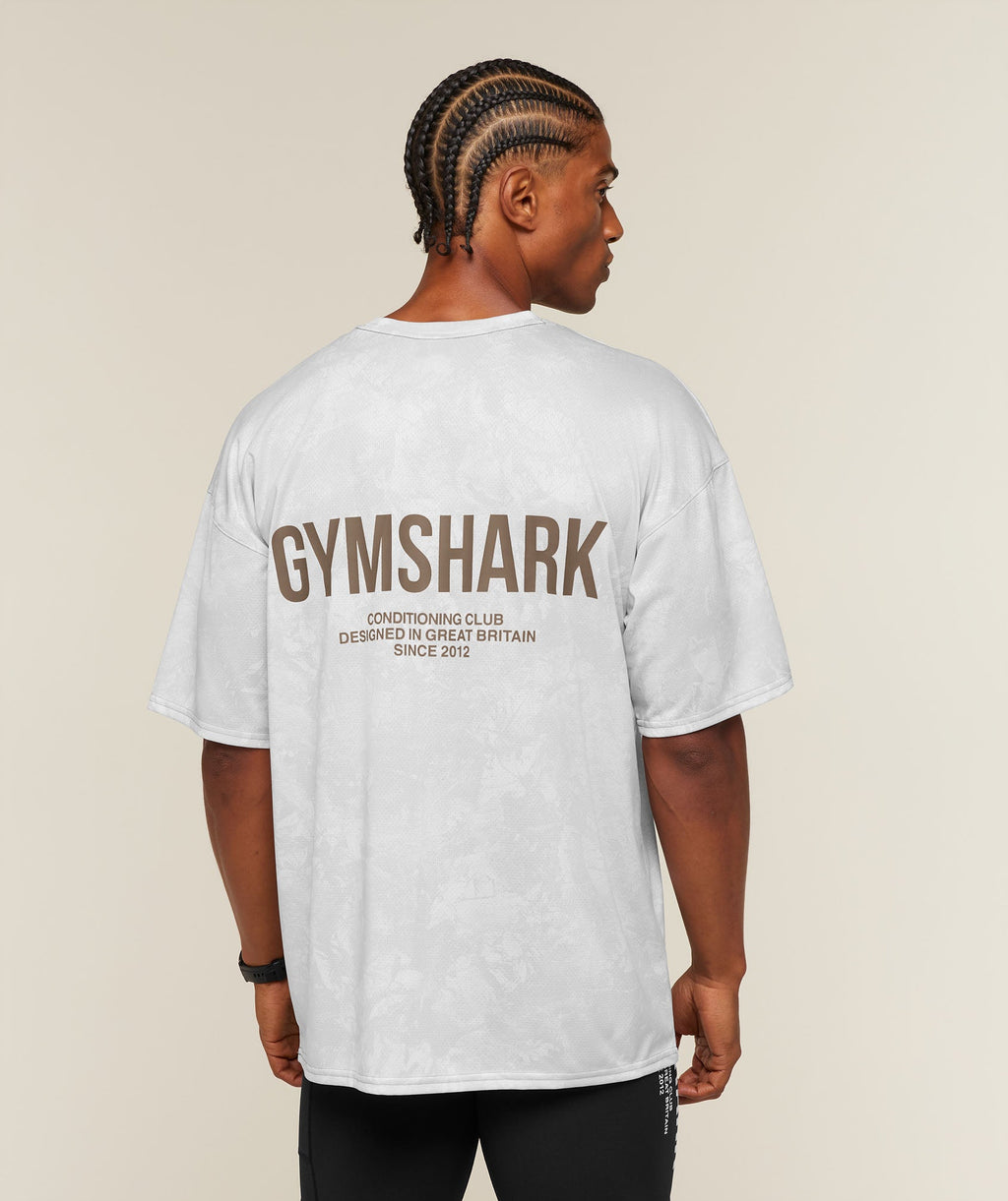 [LIMITLESS_COLOR:WHITE/LIFESTYLE BROWN] GYMSHARK Conditioning Club Oversized T-Shirt — WHITE/LIFESTYLE BROWN — vista oficial 1